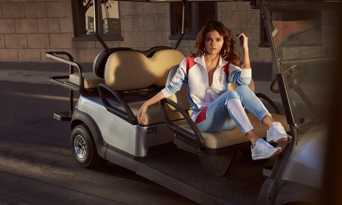 Selena Gomez in Puma tracksuit on a golf cart