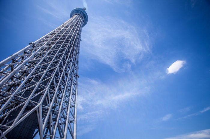 Tokyo Skytree against a blue sky with clouds
