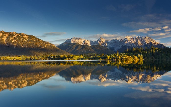 Mountains reflected in a lake at sunrise