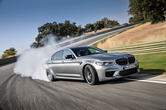 Silver BMW M5 Competition doing a burnout 4K