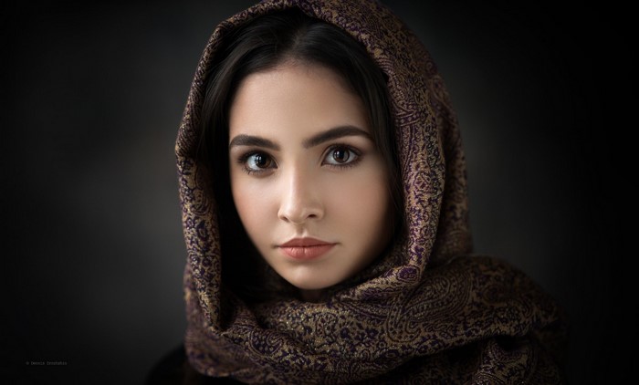 Portrait of a woman with a patterned headscarf