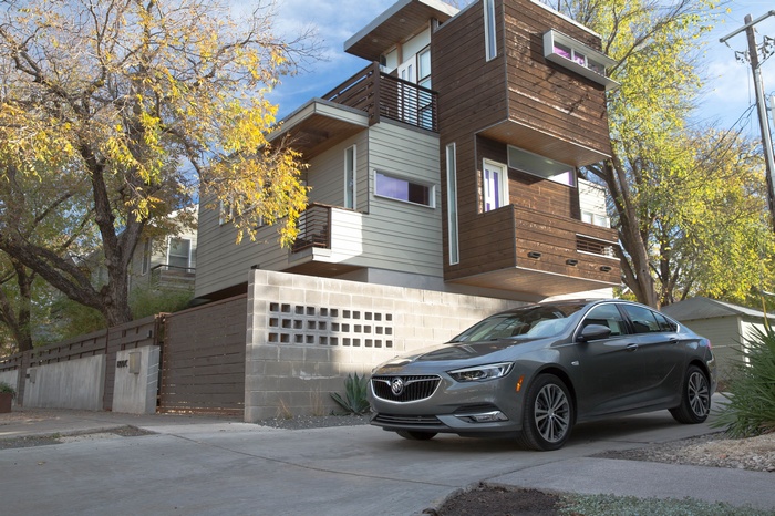 2019 Buick Regal Avenir parked in front of a modern house