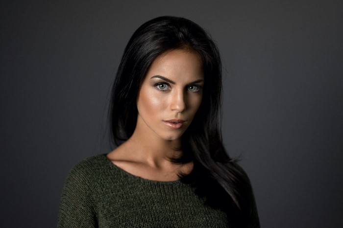 Portrait of a Woman with Green Eyes and Black Hair