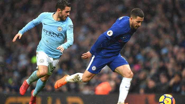 Eden Hazard and Bernardo Silva playing soccer