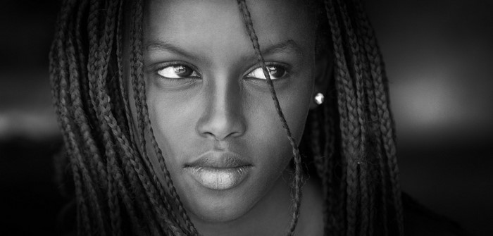 Monochrome portrait of a young woman with braided hair