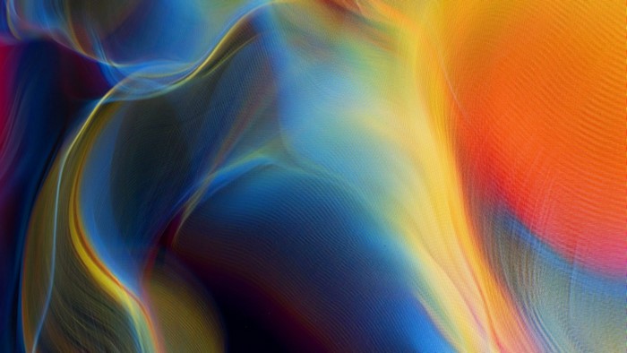 Abstract waves of blue, yellow, and orange light