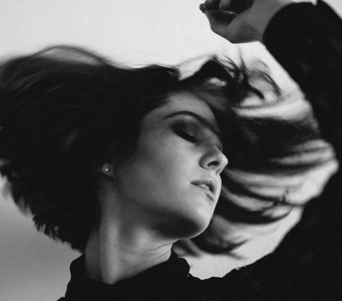 Monochrome portrait of Mary Elizabeth Winstead with hair in motion
