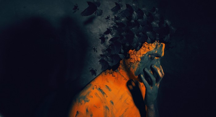 Man with birds emerging from head