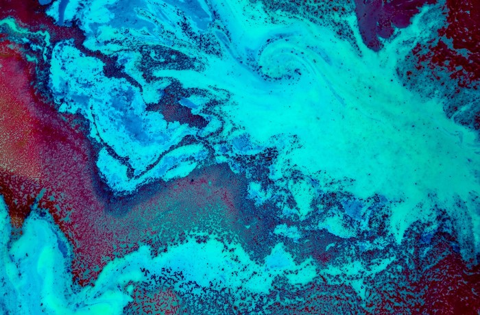 Abstract swirls of blue and red paint