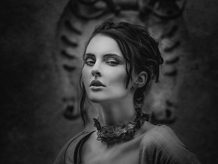 Monochrome portrait of a woman with dramatic makeup