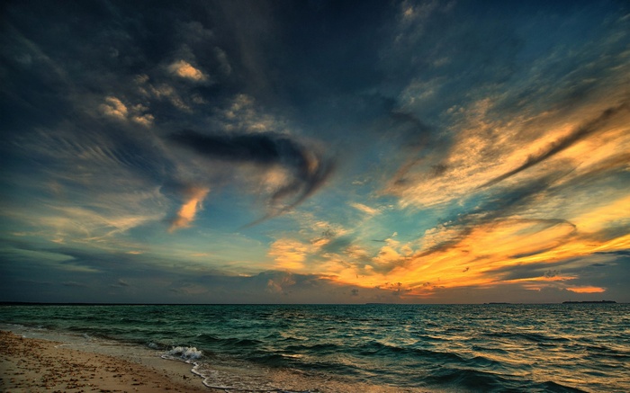 Dramatic sunset over the ocean with colorful clouds