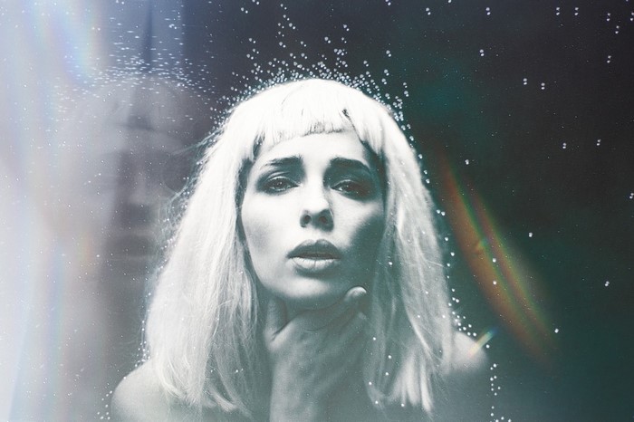 Woman with blonde hair and glitter effect