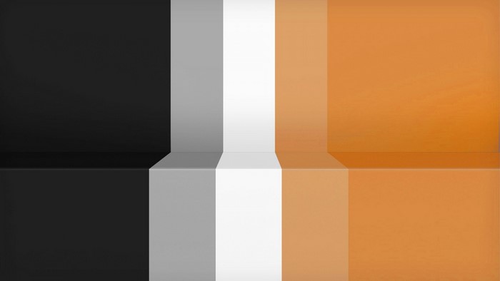 Abstract pattern of black, gray, white, and orange stripes