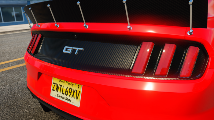 Red Ford Mustang GT with carbon fiber spoiler and spoiler