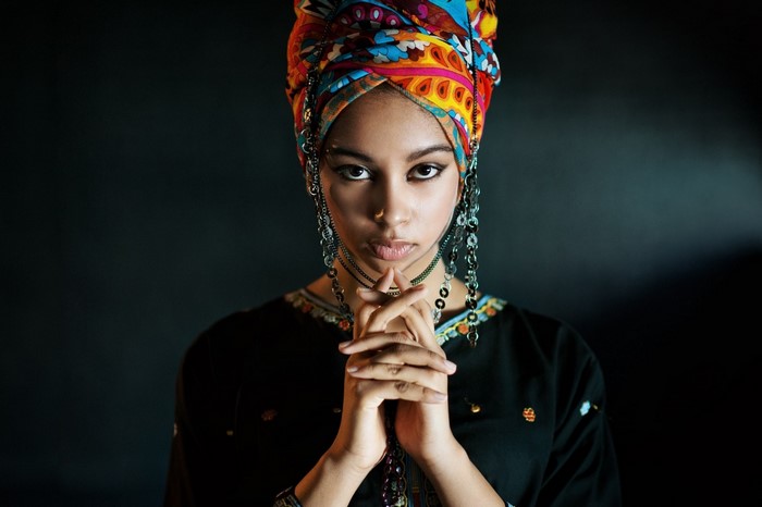 Portrait of Woman in Vibrant Headwrap and Jewelry
