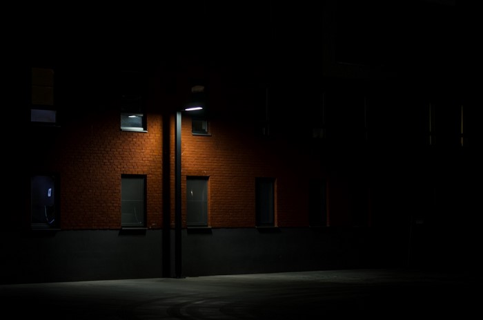 Modern brick building at night with street light