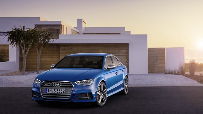 Blue Audi S3 Sedan parked in front of a modern house
