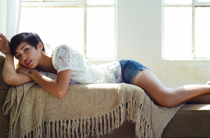 Felicia Porter lying on a couch