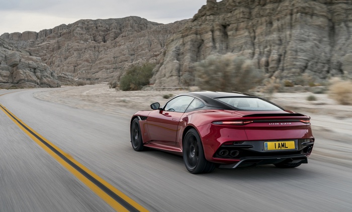 Aston Martin DBS Superleggera driving on a desert road