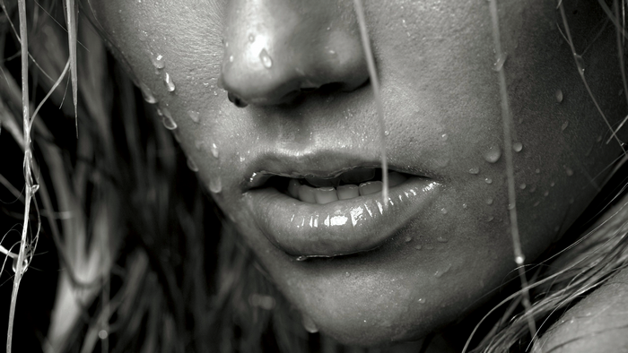 Close-up of a wet face with open mouth