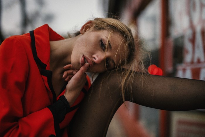 Woman in red jacket and black pantyhose
