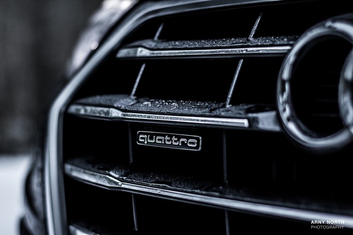 Audi Quattro emblem on a car grille