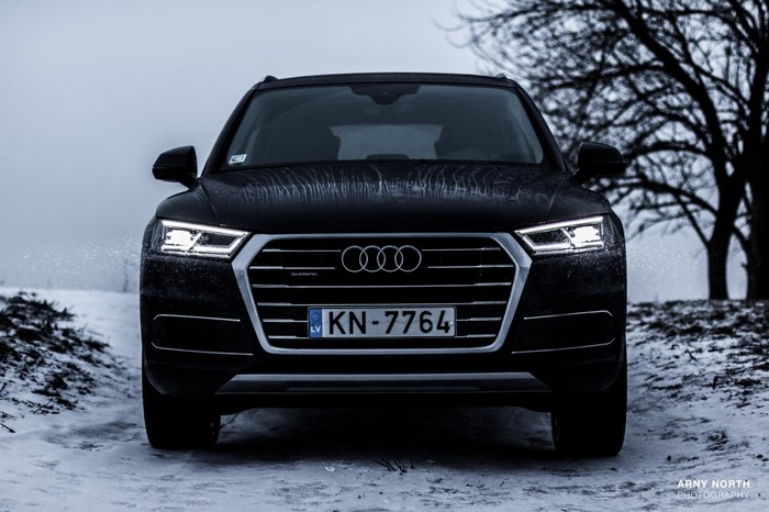 Audi Q5 in snow with license plate KN-7764