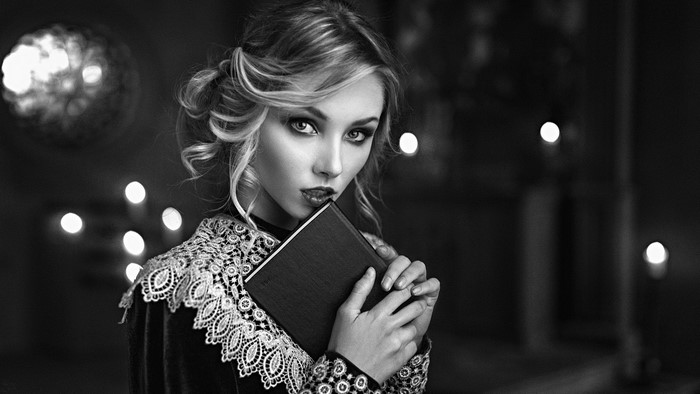 Monochrome Portrait of a Woman Holding a Book