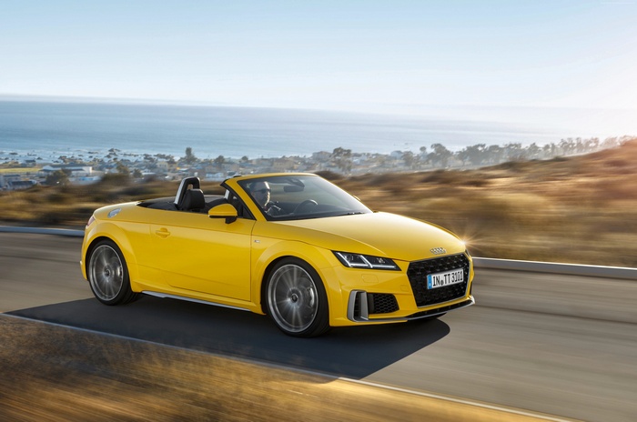 Yellow Audi TT Quattro Roadster driving on road