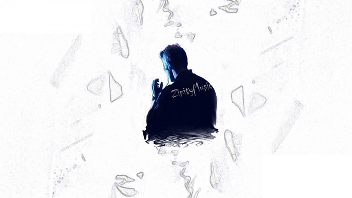 Man wearing jacket with ZinityMusic logo reflected in water