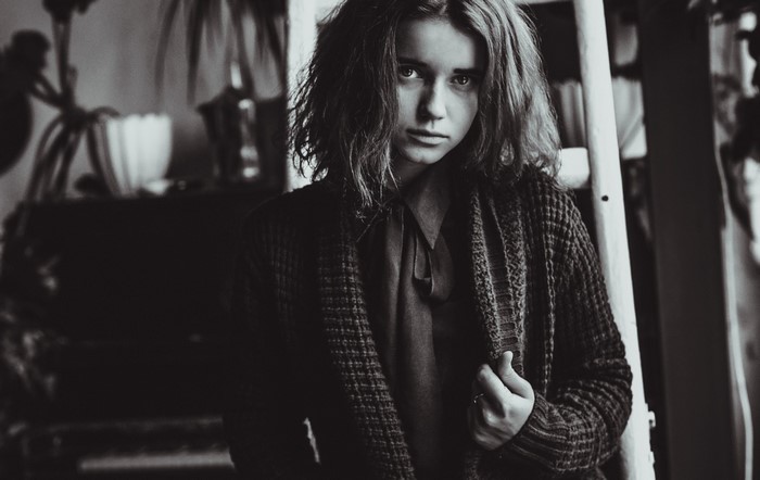 Monochrome portrait of a young woman with messy hair