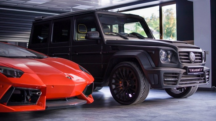 Mansory G 65 and orange Lamborghini sports car