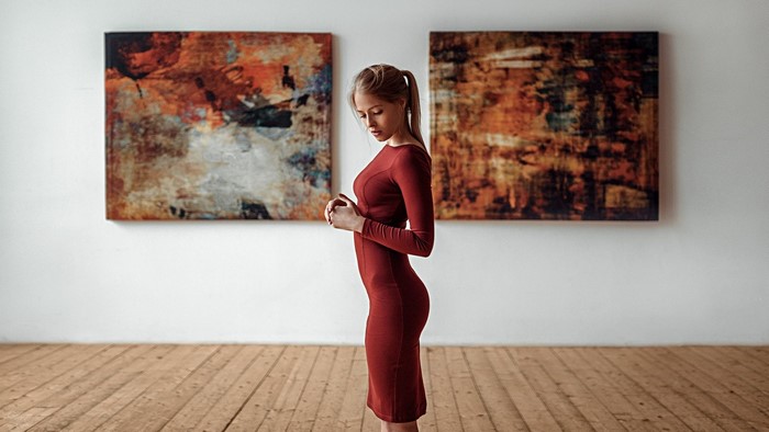 Woman in red dress in art gallery