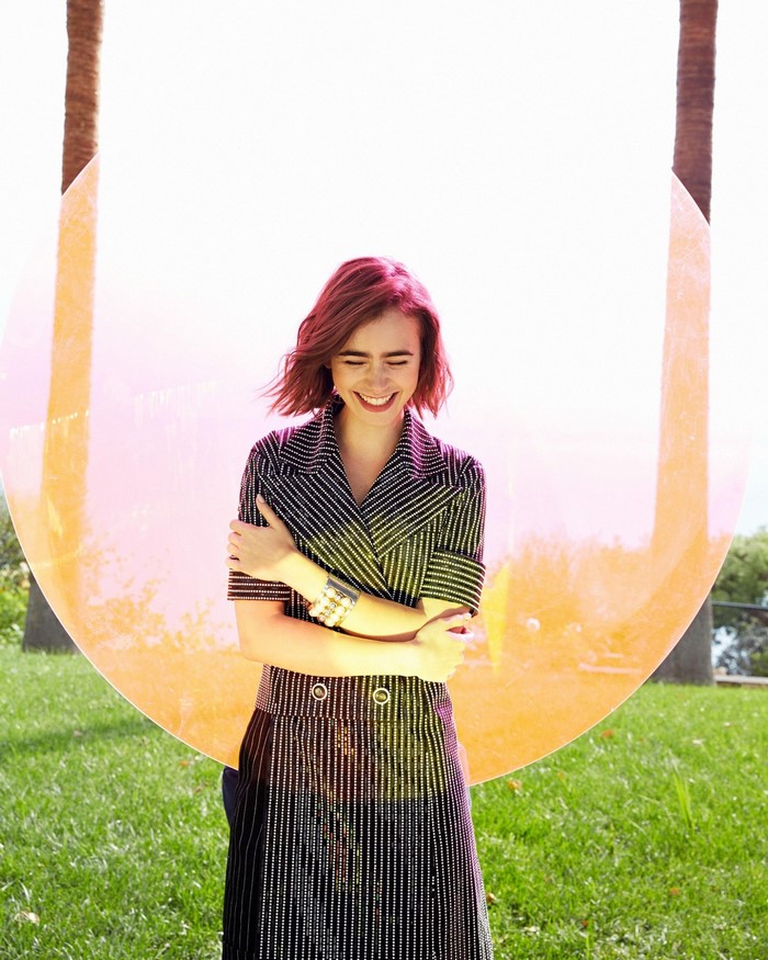 Lily Collins in a patterned dress outdoors