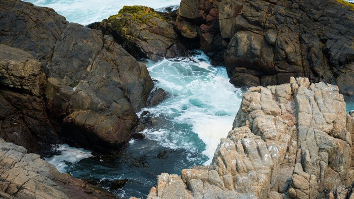 Waves crashing against rocky coast in Las Cruces, Chile