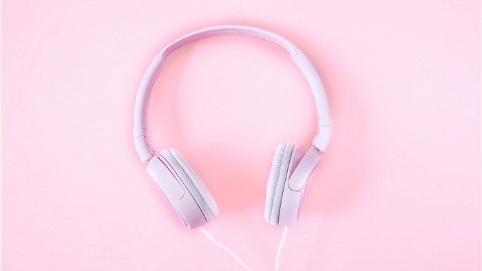 Pink headphones on a pink background