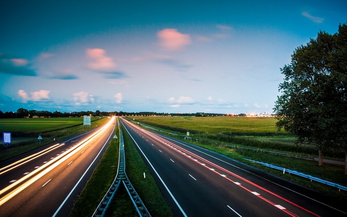 Highway at dusk with light trails
