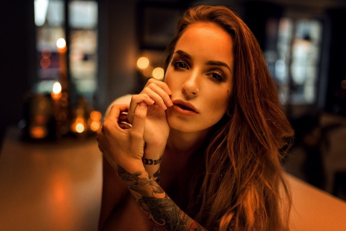 Woman with tattoos and nose ring