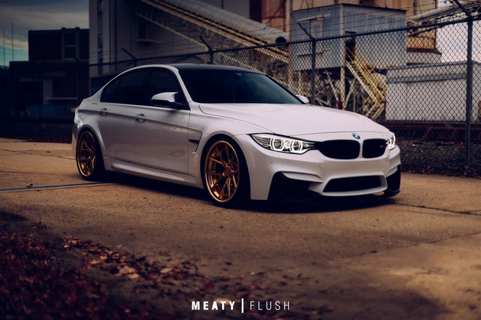 BMW M3 White Sports Sedan with Gold Rims