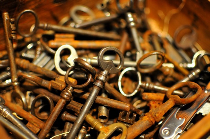 A pile of old, rusty keys