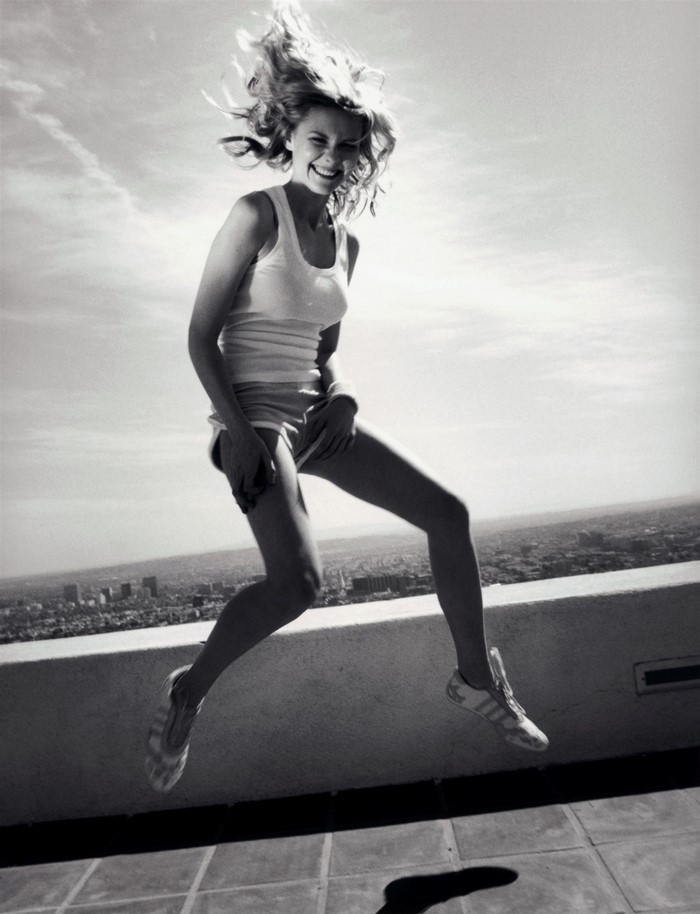 Kirsten Dunst jumping on a rooftop