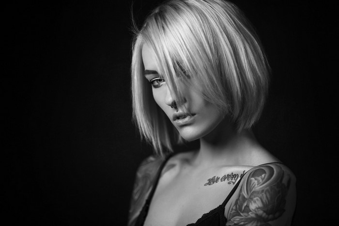 Monochrome Portrait of Blonde Woman with Tattoo and Nose Ring