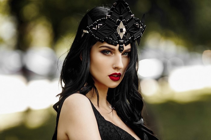 Elegant Woman in Black Dress with Bold Red Lipstick
