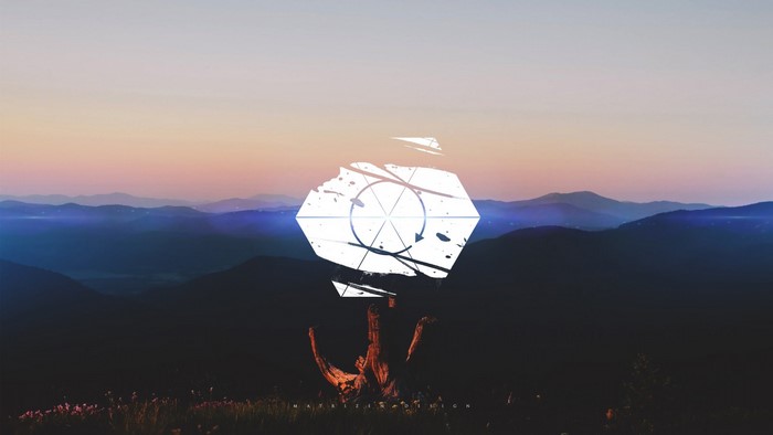Geometric shape over mountain landscape at sunset