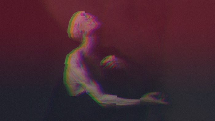 Glitch art of a person with arms outstretched