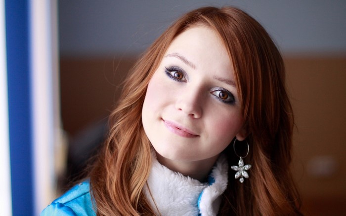 Portrait of a young woman with red hair