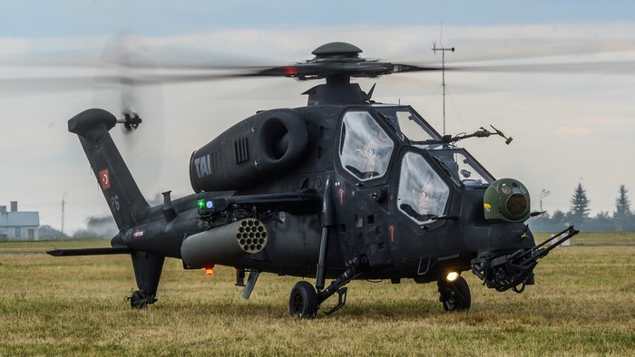 TAI T129 ATAK helicopter on a grassy field