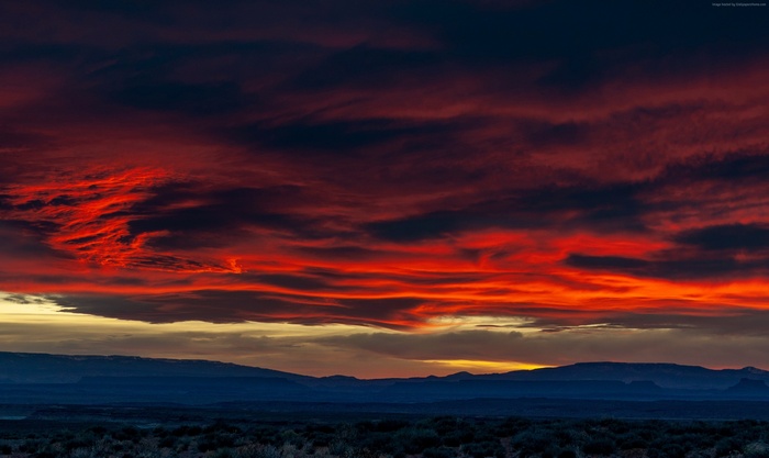Dramatic Sunset Sky Over Desert Landscape