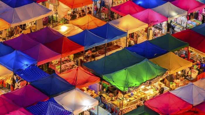 Colorful market stalls at night