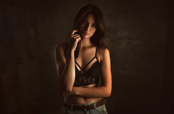 Woman in black lace bra and jeans